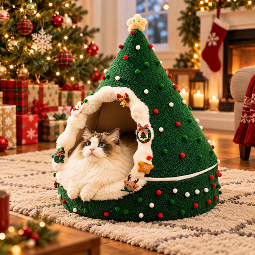 Green Christmas tree cat cave with pom-poms and a Ragdoll cat inside by the Christmas tree