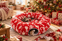 Two kittens playing in the donut tunnel bed on Christmas morning