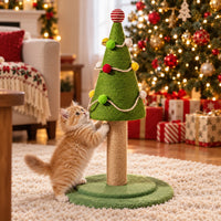 Ginger kitten scratching the Christmas tree cat scratching post